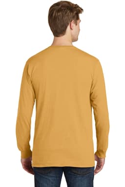 A man wearing a long sleeve, pigment-dyed tee in a warm mustard colour, viewed from the back.
