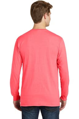 A man wearing a coral pigment-dyed long sleeve tee, viewed from the back. The shirt has a logo on it.