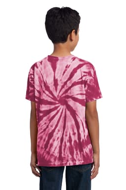 A youth tie-dye tee in shades of burgundy and pink, featuring a spiral pattern on the back.