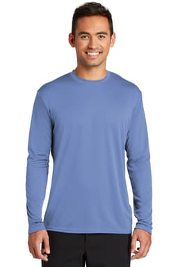 A man wearing a long sleeve performance tee in blue, featuring a logo on it and a relaxed fit.