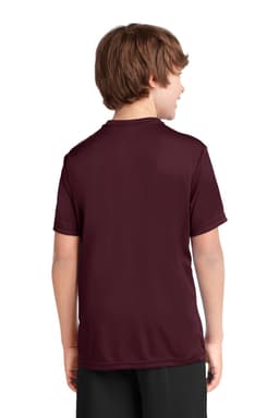 A maroon youth performance tee, featuring a logo, viewed from the back on a child wearing black shorts.