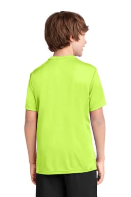 A youth performance tee in bright green, featuring a logo on the back, worn by a child facing away.