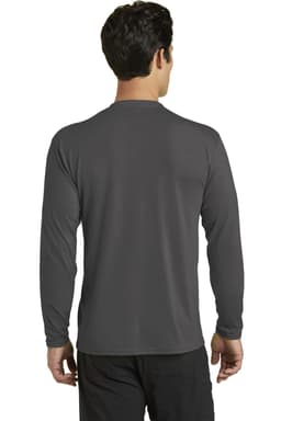 A long sleeve performance blend tee in grey, featuring a logo, shown from the back on a model.