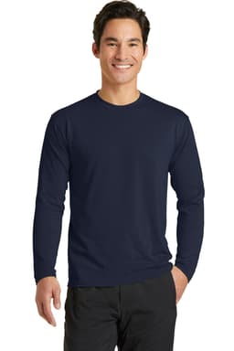 A man is wearing a navy long sleeve performance blend tee, featuring a simple design and a logo.