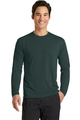 A long sleeve performance blend tee in dark green, featuring a logo, modelled by a smiling man.