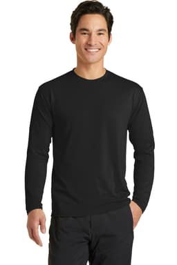 A man is wearing a black long sleeve performance blend tee. The shirt features a logo on the chest.