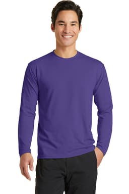 A man wearing a long sleeve performance blend tee in purple. The shirt has a logo on it.