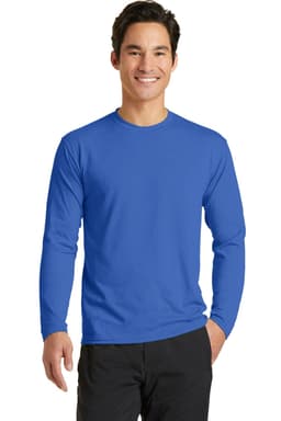 A man is wearing a blue long sleeve performance blend tee. The shirt features a logo on the chest.