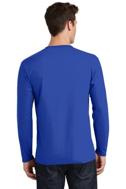A man stands facing away, wearing a long sleeve tee in bright blue, with a plain back and dark jeans.
