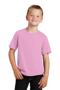 A young boy wearing a light pink t-shirt, smiling and posing with his hands by his sides. The shirt has a logo.