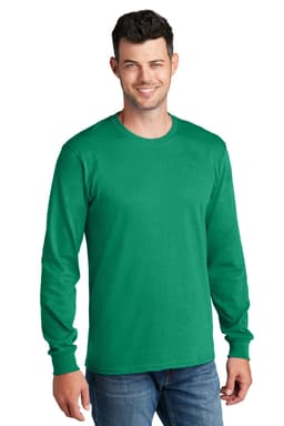 A man wearing a green long sleeve cotton tee, standing casually with a friendly smile. The shirt has a logo.