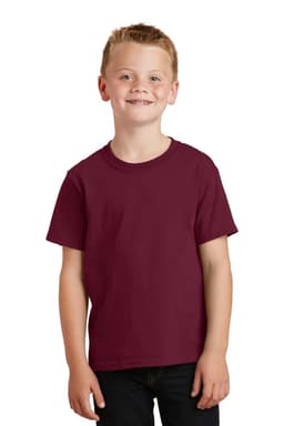 A young child wearing a maroon youth t-shirt, standing and smiling, with a simple design and no visible logos.
