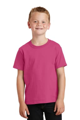 A youth in a vibrant pink T-shirt, standing and smiling against a plain background. The shirt has a logo on it.