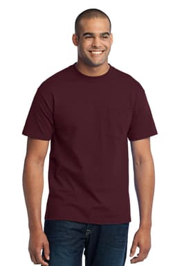 A man wearing a maroon short-sleeve pocket t-shirt, paired with blue jeans. The shirt features a logo.
