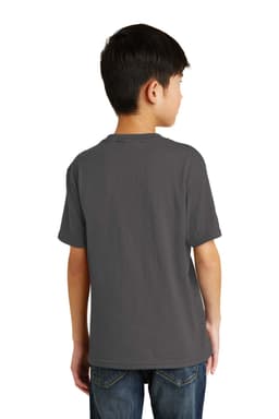 A youth in a grey t-shirt stands with his back facing the camera, wearing denim jeans. The t-shirt has a logo.