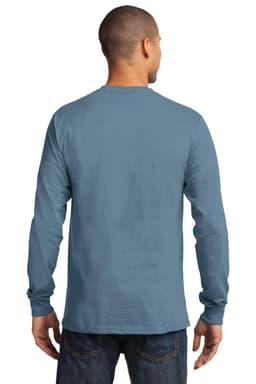 A man is wearing a long sleeve essential tee in blue, featuring a simple design and a logo on the back.