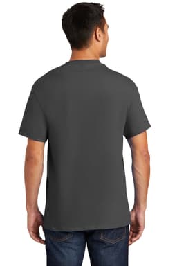 A man wearing a grey Port & Company Essential Pocket Tee, viewed from the back, paired with jeans.