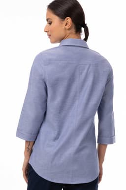 A blue women's classic shirt with three-quarter sleeves, featuring a collar and a logo on the back.