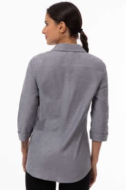 A grey women's classic shirt with a collar and three-quarter sleeves, featuring a subtle texture and an embroidered logo.