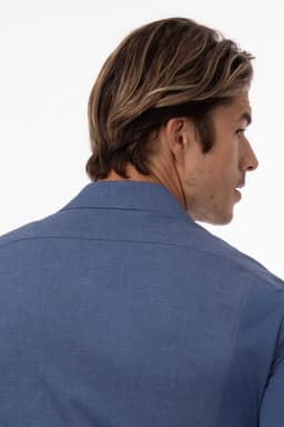 A men's shirt in black with a tailored fit, displaying the back view and featuring a collar.
