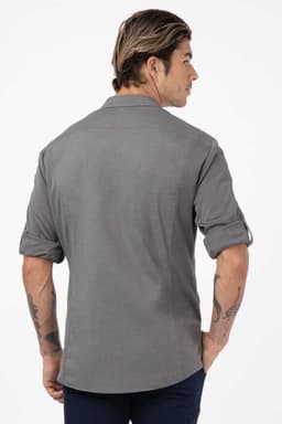 A men's shirt in black, featuring a classic design and rolled sleeves, with a logo on the back.