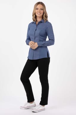 A blue women's shirt with long sleeves, paired with black pants and white shoes. The shirt features a collar and buttons.