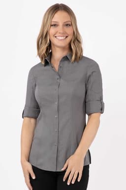 A women's grey shirt with rolled-up sleeves and a fitted design, featuring a logo on the breast area.