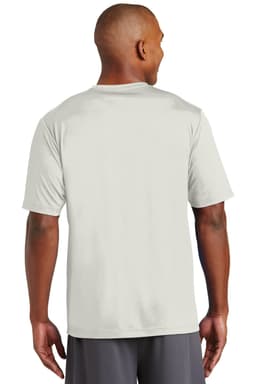 A man is wearing a light grey t-shirt, showing the back view. The shirt has a logo on it.