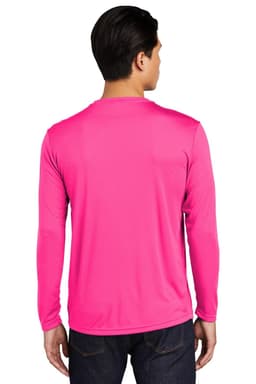 A man wearing a bright pink long sleeve performance t-shirt, featuring a simple design and a logo.