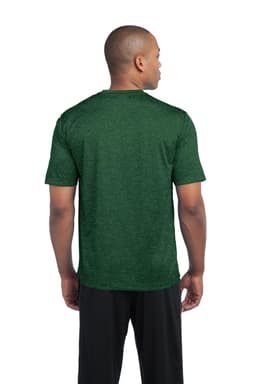 A man in a green heather t-shirt, viewed from the back, wearing black shorts. The shirt features a logo.