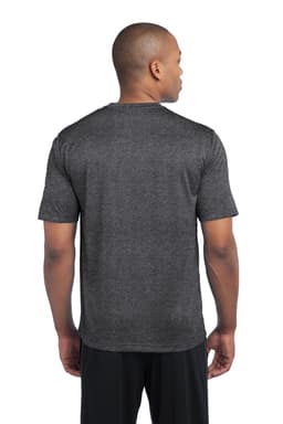 A person wearing a dark heather grey Sport-Tek Heather Contender Tee from the back, featuring short sleeves.