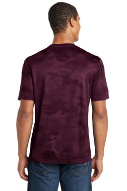 A maroon Sport-Tek CamoHex Tee featuring a camouflage pattern on the back, worn by a model.