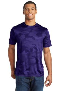 A man wearing a purple camouflage patterned t-shirt, featuring a logo on the front.
