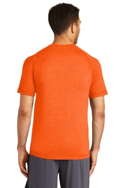 A man wearing an orange Sport-Tek PosiCharge Tri-Blend Wicking Raglan Tee, viewed from the back.