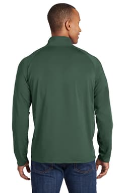 A man wearing a dark green Sport-Tek Sport-Wick Stretch 1/2-Zip Pullover, viewed from the back.