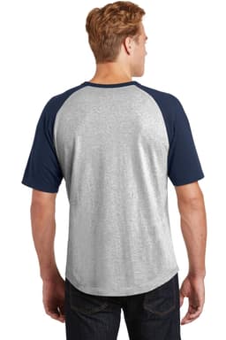 A short sleeve colourblock raglan jersey in grey with navy sleeves, featuring a logo on the back.