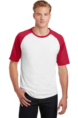 A man wearing a short sleeve, white and red colourblock raglan t-shirt with a logo.