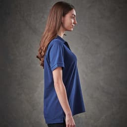 A women's navy polo shirt with a classic fit and short sleeves. Features a logo on the chest.