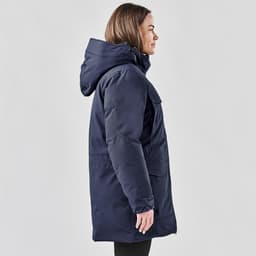 A navy blue Women's Denali Parka jacket featuring a hood and side pockets, displayed on a model.