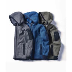 Three hoodies in grey, blue, and olive green, featuring zip closures and pocket details, arranged together.