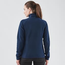 A navy women's fleece jumper with a 1/4 zip and a fitted design, featuring a logo on the back.