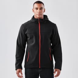 A black softshell hoody with red accents, featuring a zip front, zip pockets, and a hood. Includes branding.