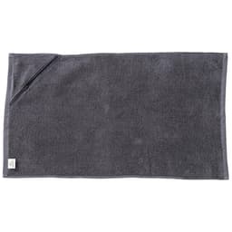 A dark grey gym towel with a pocket, made of soft material, featuring a small logo on one corner.