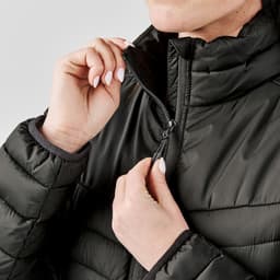 A black Montserrat thermal jacket with a high collar, featuring a zippered closure and elastic cuffs.