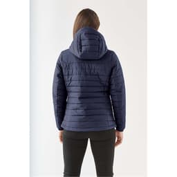 A navy women's quilted hoody with a hood, featuring horizontal stitching and a sleek design.