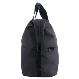 A grey duffle bag with a rounded top, featuring handles and a strap, includes a logo on the front.