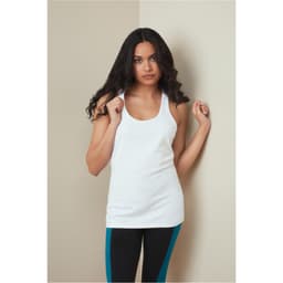 A woman models a white tank top, paired with black leggings featuring turquoise stripes. The top has a logo.
