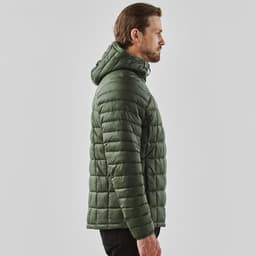 A olive green puffer jacket with a hood, featuring a quilted design. It has a logo on the garment.