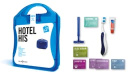 A blue travel kit containing shaving items, aloe vera, shampoo, and foot refresh products, all packaged in a clear case.