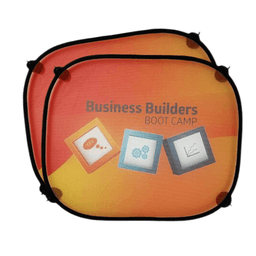 Two round sunshades with vibrant orange and yellow hues and a black border, featuring graphics and branding.